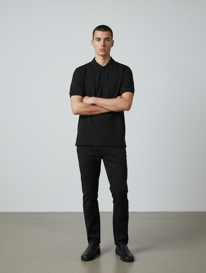 Home Kind black 100% cotton polo shirt with a textured finish, structured collar, and button placket.