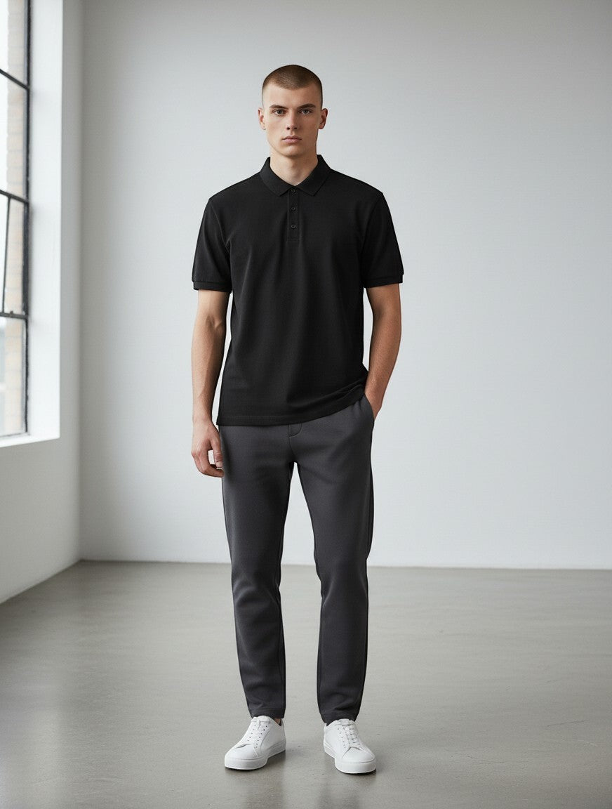 Home Kind black 100% cotton polo shirt with a textured finish, structured collar, and button placket.