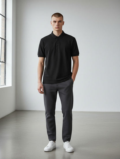 Home Kind black 100% cotton polo shirt with a textured finish, structured collar, and button placket.