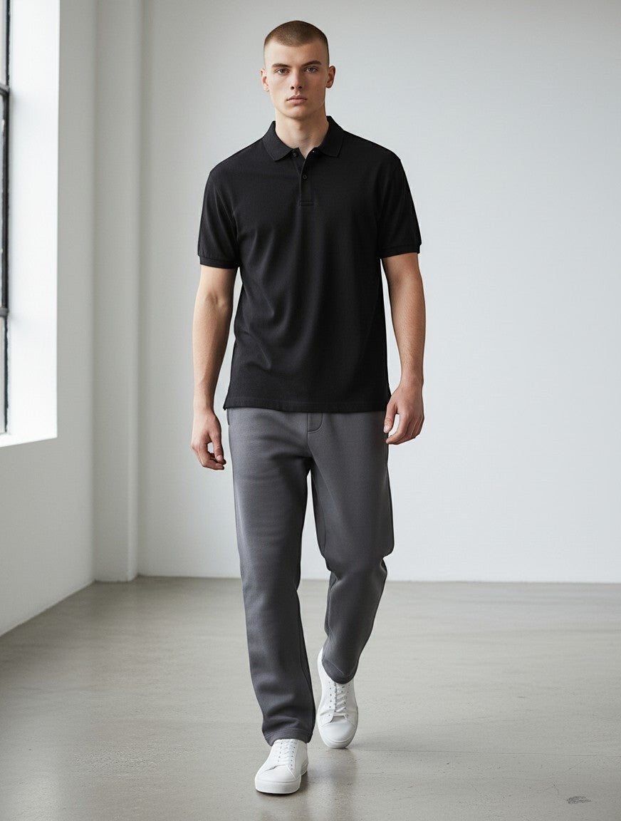 Home Kind black 100% cotton polo shirt with structured collar and cuffs, 220 GSM Airtex textured finish.