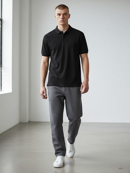 Home Kind black 100% cotton polo shirt with structured collar and cuffs, 220 GSM Airtex textured finish.