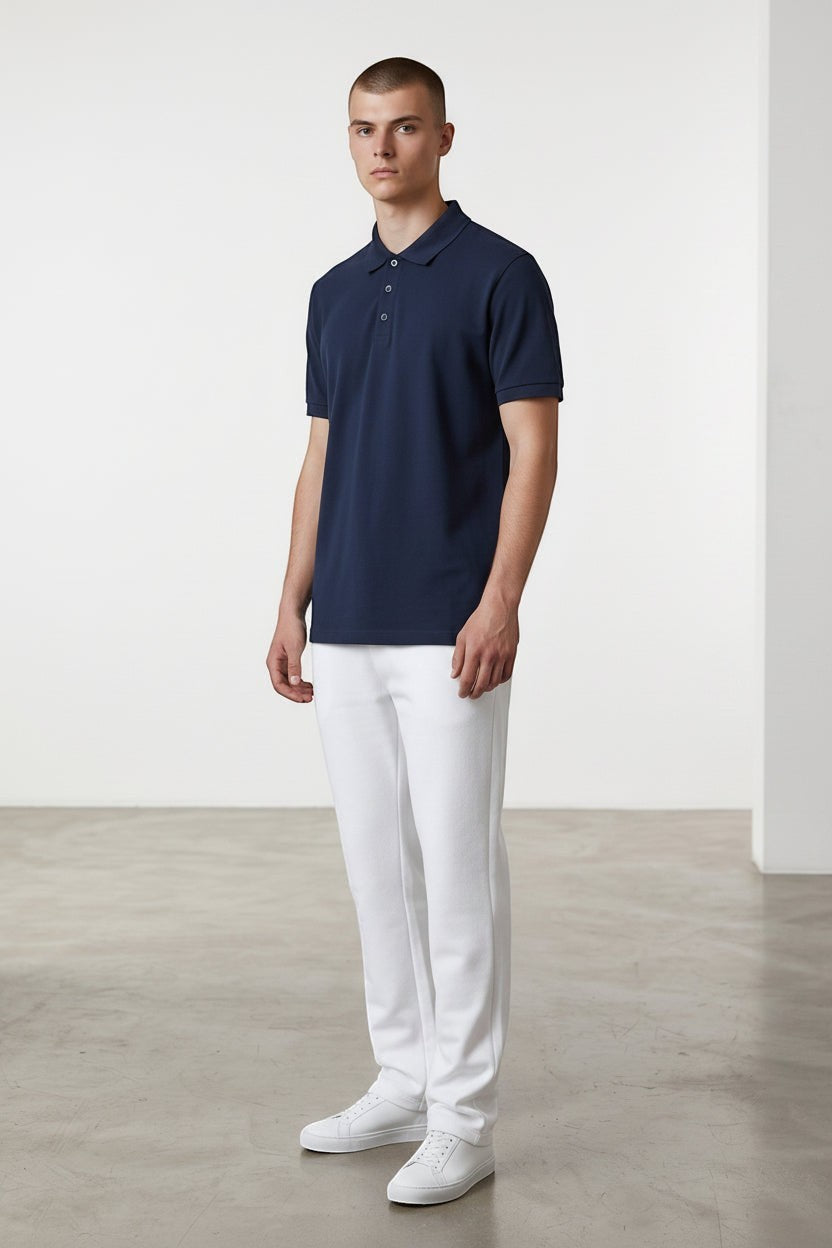 Home Kind navy blue 100% cotton polo shirt with a structured collar and cuff, 220 GSM Airtex textured finish.