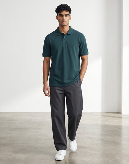 Home Kind petrol blue 100% cotton polo shirt with textured finish, regular fit, and structured collar.
